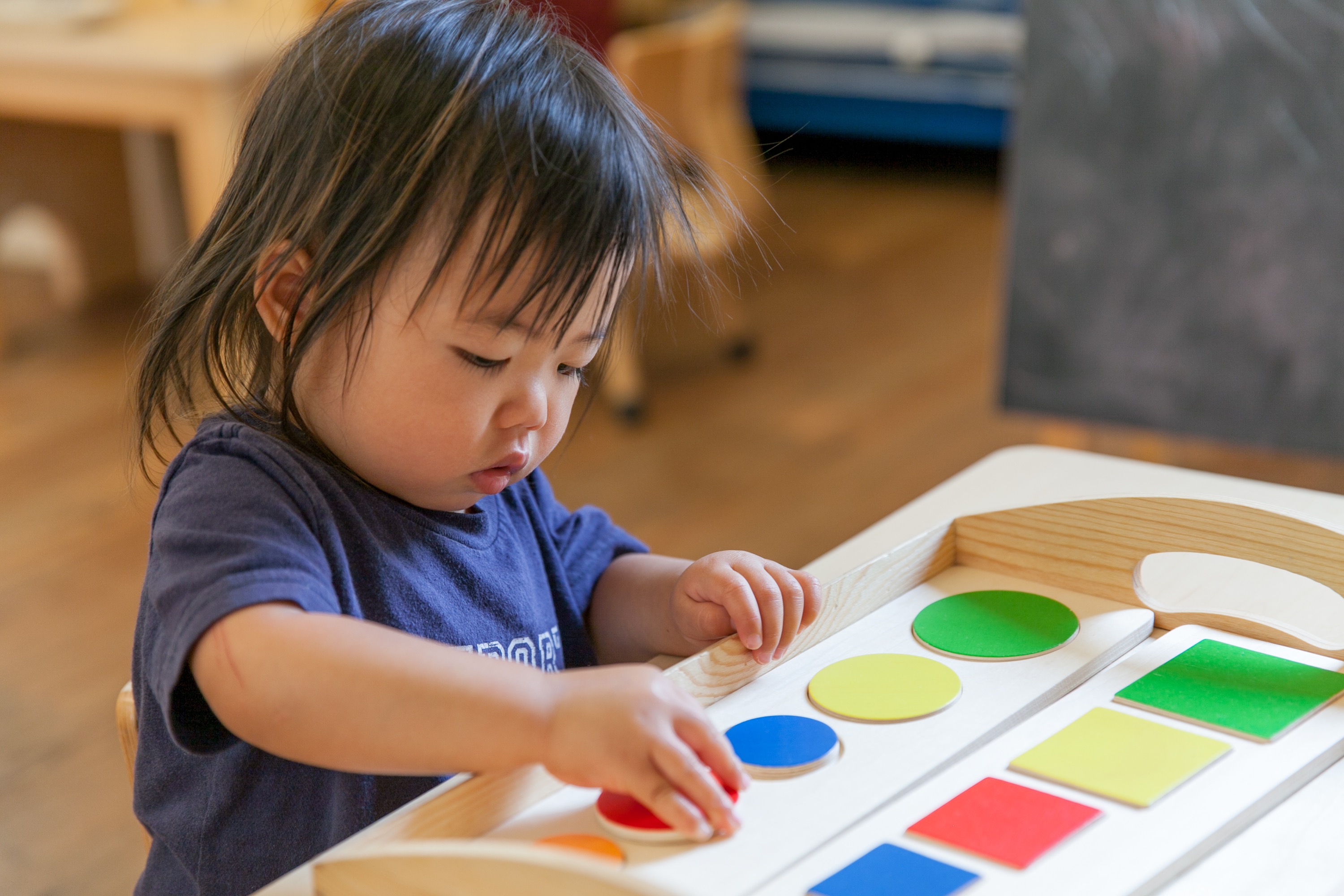 This Toddler Is Learning About Shapes And Colors With Montessori 